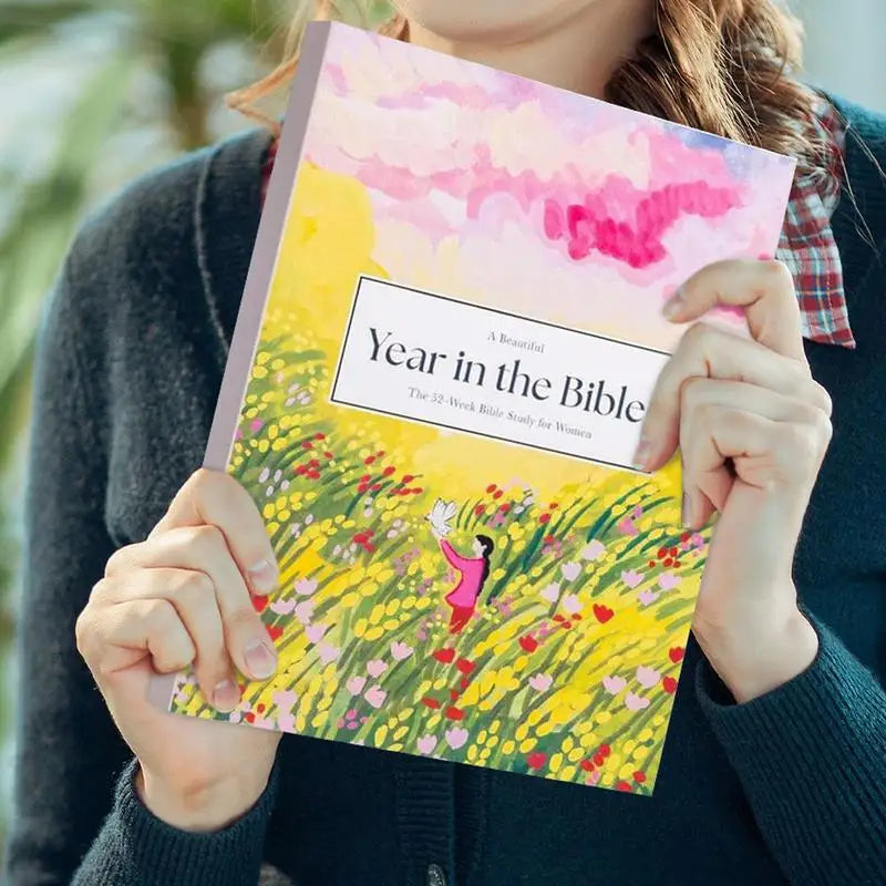 52-Week Bible Study Journal for Women cover with floral design

Woman holding 52-week Christian devotional book

Inside pages of Bible study journal with scripture reflections