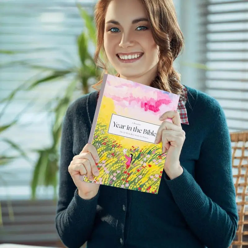 52-Week Bible Study Journal for Women cover with floral design

Woman holding 52-week Christian devotional book

Inside pages of Bible study journal with scripture reflections